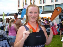 Amanda Collins receiving her award after completing The British Gas Great London Swim
